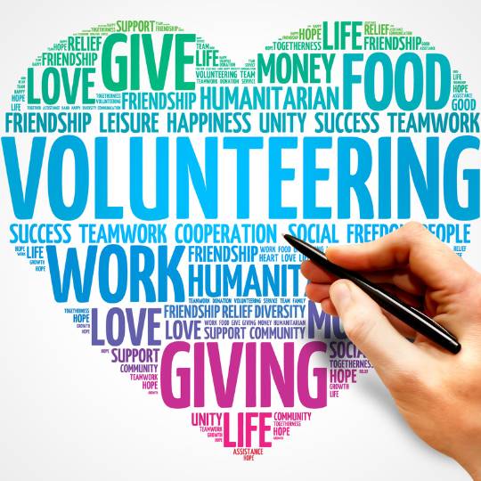 Volunteering word shaped as a heart